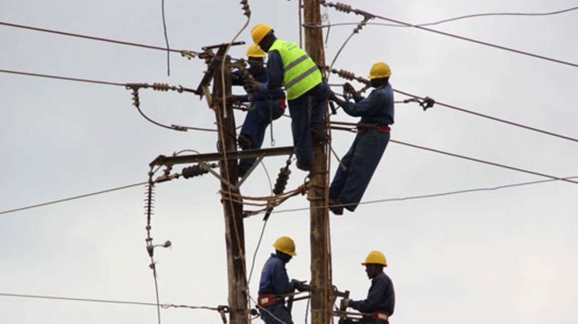 Kenya power employees working on an electricity transmission line. the company is expected to launch its Internet service provision by the end of this financial year.  