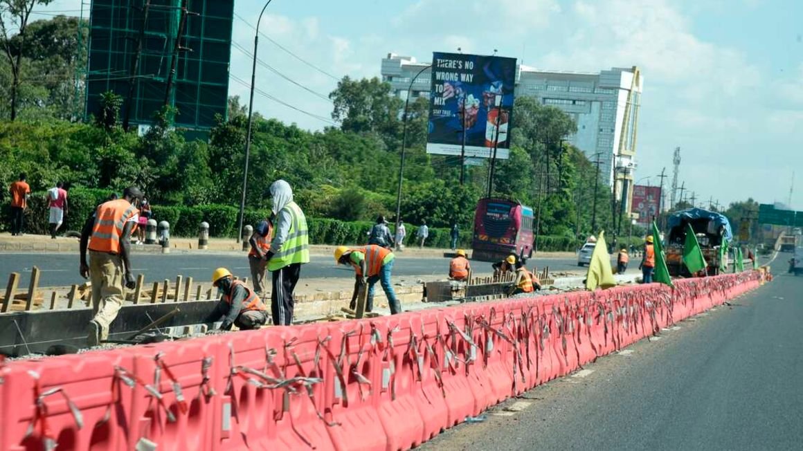 workers working on the brt lane on thika superhighway.