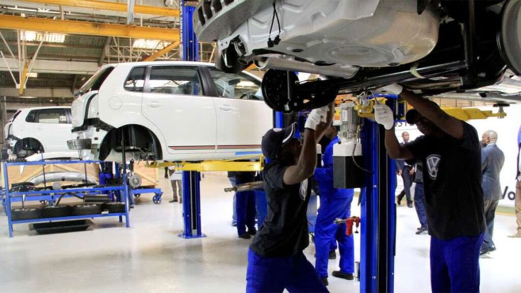Workers at the Thika Based Kenya Vehicle Manufacturers. The are assembling a Volkswagen car. Volkswagen will be a big beneficiary of the recently announced tax exemptions targeting Car manufacturers.