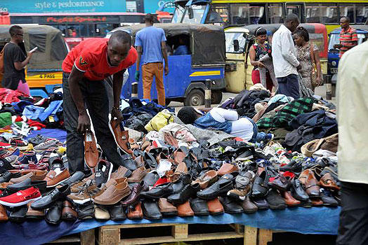 A Shoe hawker selling shoes in the streets of Nairobi. Hawkers are currently a big menace in the city especially the CBD having occupied almost every street.  