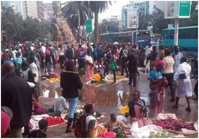 A Shoe hawker selling shoes in the streets of Nairobi. Hawkers are currently a big menace in the city especially the CBD having occupied almost every street.